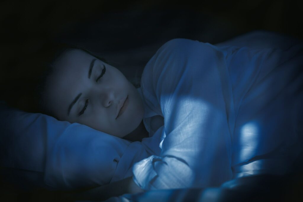 A young woman sleeps restfully after a massage.